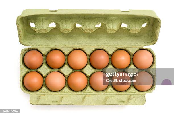 eggs in a carton on white background - dozen stock pictures, royalty-free photos & images