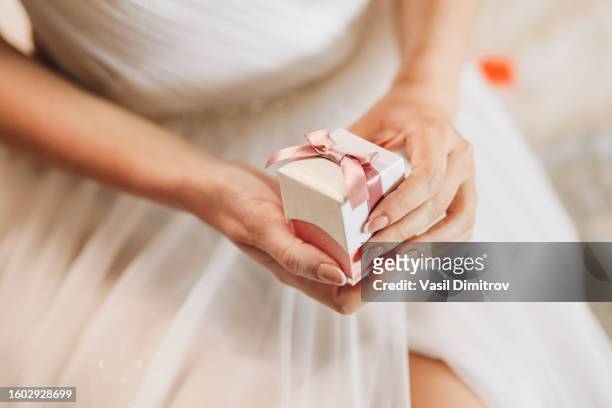 bride holding a box with jewelry - gold hoop earring stock pictures, royalty-free photos & images