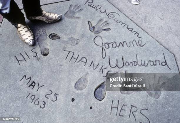 Paul Newman and Joanne Woodward's hand and foot prints in the cement outside of Mann's Chinese Theater in 1991 in Los Angeles, California. The date...