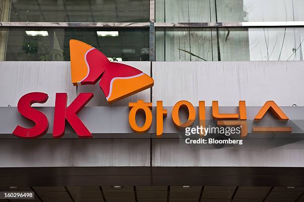 The SK Hynix Inc. Logo is displayed above the entrance to the company's headquarters in Seoul, South Korea, on Monday, Jan. 28, 2013. Hynix is...
