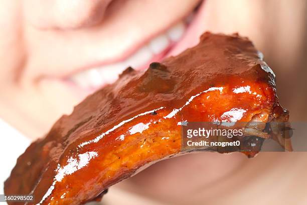 woman eating barbecue - juicy lips stock pictures, royalty-free photos & images