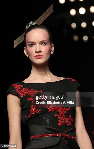 Model walks the runway during Jamal Taslaq S/S 2013 Haute Couture colletion fashion show as part of AltaRoma AltaModa Fashion Week at Santo Spirito...