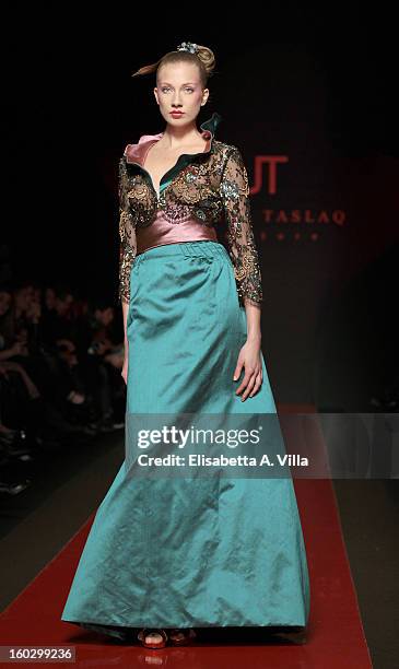 Model walks the runway during Jamal Taslaq S/S 2013 Haute Couture colletion fashion show as part of AltaRoma AltaModa Fashion Week at Santo Spirito...