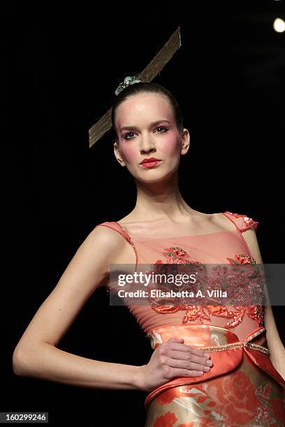 Model walks the runway during Jamal Taslaq S/S 2013 Haute Couture colletion fashion show as part of AltaRoma AltaModa Fashion Week at Santo Spirito...