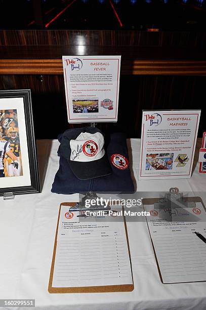 Doug Flutie autographed memorabilia to be auctioned to raise money for the10th Annual Flutie Bowl to strike out autism at KINGS on January 28, 2013...