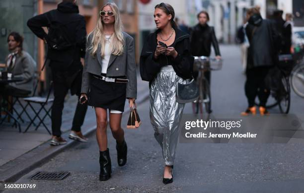 Guest seen wearing light beige / latte oval sunglasses, silver necklace, white printed cropped t-shirt, grey striped cropped blazer jacket, white...