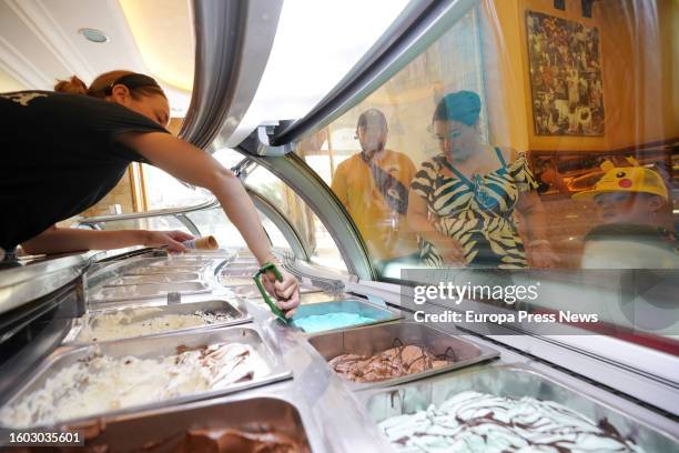 Person serves an ice cream in an ice cream shop on August 9 in Vitoria Gasteiz, Alava, Basque Country, Spain. Euskadi remains today on orange alert...