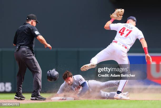 Edouard Julien of the Minnesota Twins tags out Matt Vierling of the Detroit Tigers in the eighth inning at Target Field on August 16, 2023 in...