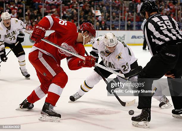 Cory Emmerton of the Detroit Red Wings faces off against Tom Wandell of the Dallas Stars at Joe Louis Arena on January 22, 2013 in Detroit, Michigan.