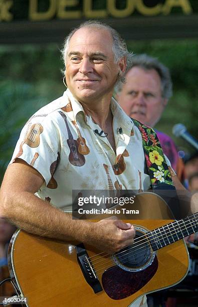 Singer Jimmy Buffett performs on NBC''s "Today Show" July 20, 2001 in New York City.