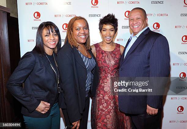 Actress Angela Bassett poses with guests at the premiere of "Betty & Coretta" to celebrate with Lifetime and cast at Tribeca Cinemas on January 28,...