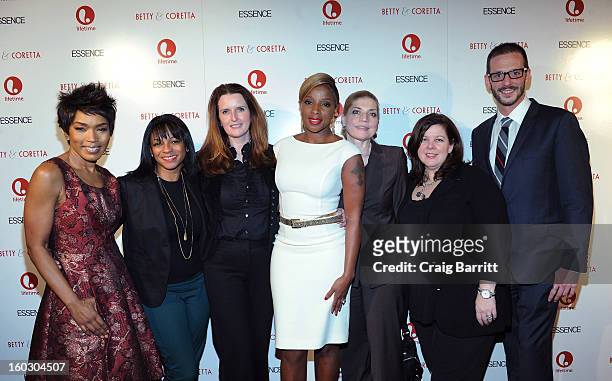 Mary J. Blige and Angela Bassett pose with guests at the premiere of "Betty & Coretta" to celebrate with Lifetime and cast at Tribeca Cinemas on...