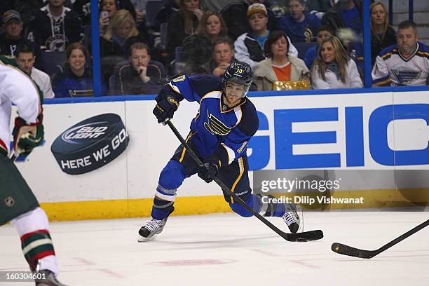 Andy McDonald of the St. Louis Blues shoots the puck against the Minnesota Wild at the Scottrade Center on January 27, 2013 in St. Louis, Missouri.