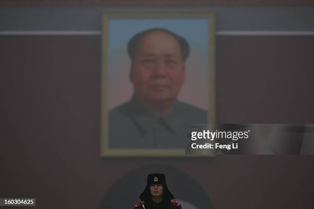 Chinese policeman guards under the Tiananmen Gate during dangerous levels of air pollution on January 29, 2013 in Beijing, China. The 4th dense fog...