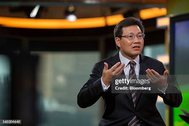 Gerry Wang, chief executive officer of Seaspan Corp., gestures as he speaks during an interview in Hong Kong, China, on Tuesday, Jan. 29, 2013....