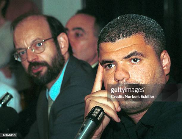 Belgian lawyer, Luc Walleyn, left, addresses a press conference as Palestinian plaintiff, Mohamed Abou Roudeina sits beside him July 20, 2001 in...