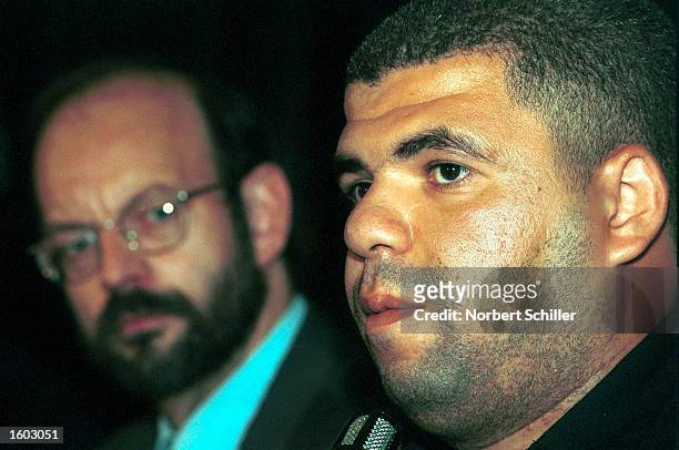 Belgian lawyer, Luc Walleyn, left, addresses a press conference as Palestinian plaintiff, Mohamed Abou Roudeina sits beside him July 20, 2001 in...