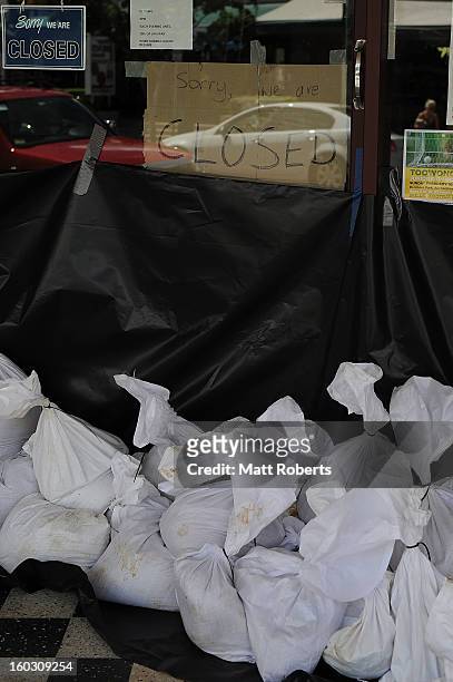 Sandbags seen in front of a shop in the inner city suburb of Rosalie prior to today's high tide as parts of southern Queensland experiences record...