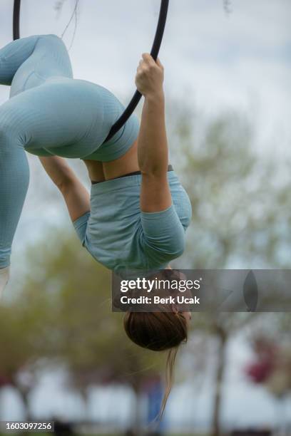 female aerial dancer on the hoop. - lyra stock pictures, royalty-free photos & images
