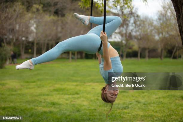 female aerial dancer on the hoop. - lyra stock pictures, royalty-free photos & images