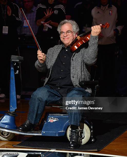 Itzhak Perlman performs 'The Star-Spangled Banner'before the Orlando Magic vs Brooklyn Nets game at Barclays Center on January 28, 2013 in the...