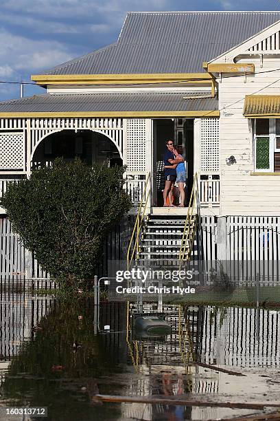 Residents look on as floods suround their house as parts of southern Queensland experiences record flooding in the wake of Tropical Cyclone Oswald on...