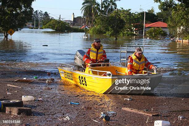 State Emergency Service patrol the streets on boat as parts of southern Queensland experiences record flooding in the wake of Tropical Cyclone Oswald...