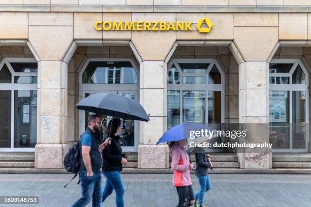 entrance and sign of commerzbank branch - commerzbank stock pictures, royalty-free photos & images