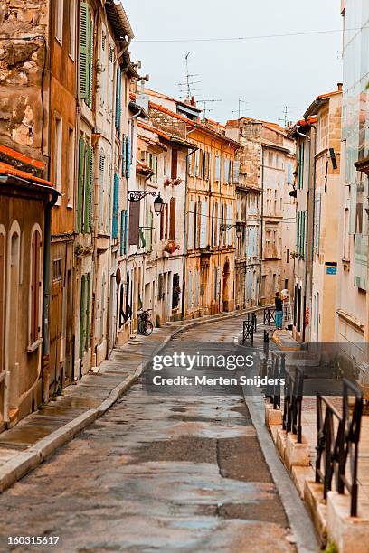 street with colorful window shutters - arles stock pictures, royalty-free photos & images