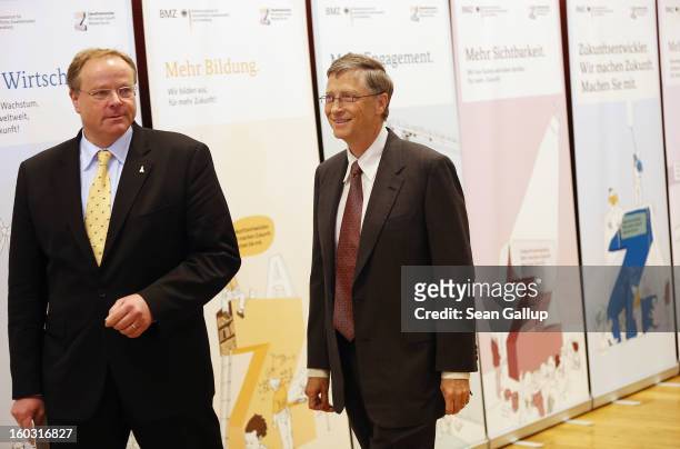 German Development Minister Dirk Niebel and Microsoft founder Bill Gates arrive to speak to the media after talks at the Development Ministry on...