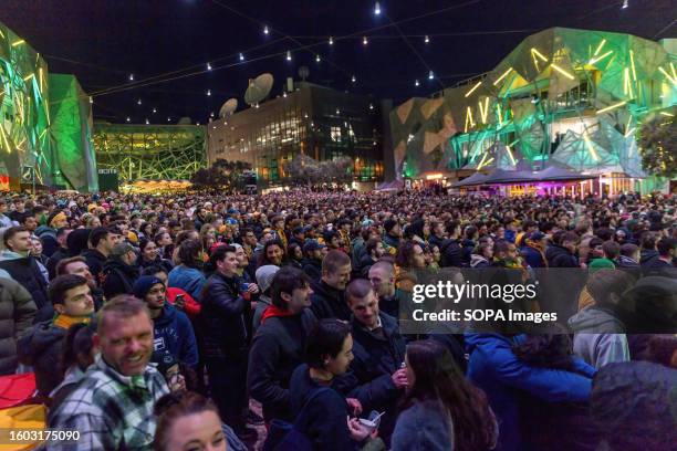 Crowd of Matildas fans in the standing room only watch the game at Federation Square during the Women's World Cup semifinal in Melbourne. Australian...