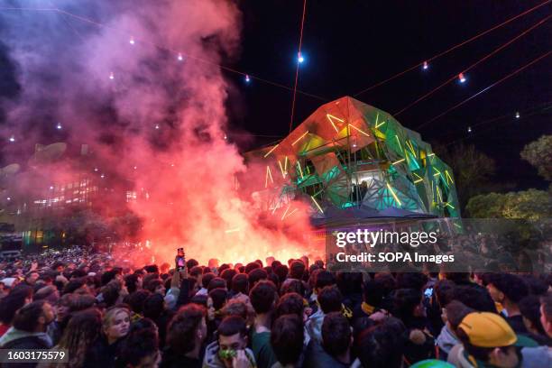 Red smoke flares seen in the crowd as Matildas fans watch the game at Federation Square during the Women's World Cup semifinal in Melbourne....