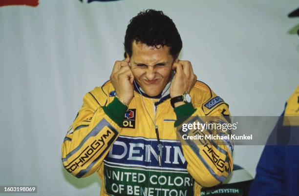 German racing driver Michael Schumacher, wearing his yellow coveralls, ahead of the European Grand Prix, held at Donington Park, Leicestershire,...