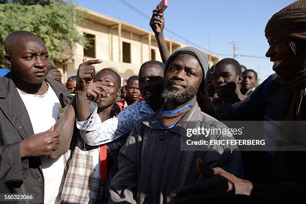 The crowd points on January 29, 2013 at a man suspected of being an Islamist in Timbuktu after a French-led troops freed the northern desert city on...