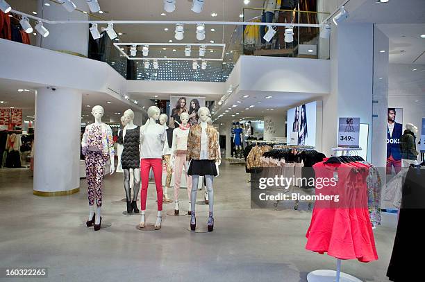 Mannequins displaying women's clothing stand inside a Hennes & Mauritz AB store in Stockholm, Sweden, on Tuesday, Jan. 29, 2013. Hennes & Mauritz AB,...