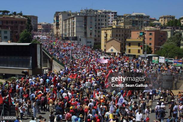 Tens of thousands of anti-G8 protesters march July 21, 2001 in Genoa, Italy. Several thousand violent protesters battled with police and destroyed...
