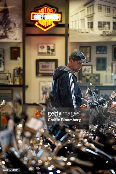 Customer looks at a Harley-Davidson Inc. Motorcycle on the showroom floor at the Dudley Perkins Co. Dealership in South San Francisco, California,...