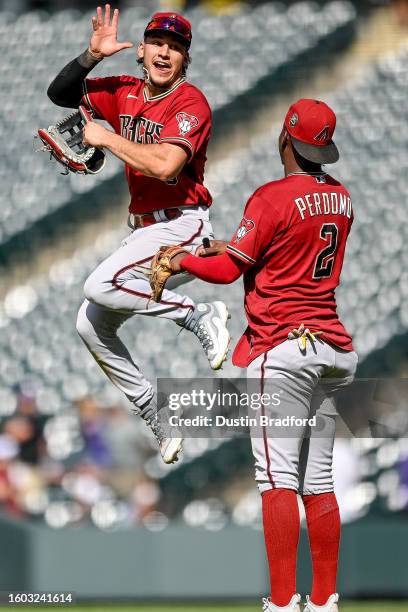 Alek Thomas and Geraldo Perdomo of the Arizona Diamondbacks celebrate after a win against the Colorado Rockies at Coors Field on August 16, 2023 in...