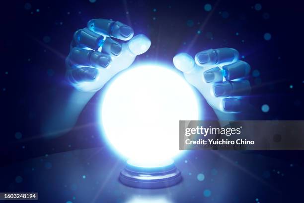 robot fortune teller hand and crystal ball - boule de cristal photos et images de collection