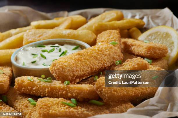 crispy fish sticks and steak cut fries - fried seafood stock pictures, royalty-free photos & images