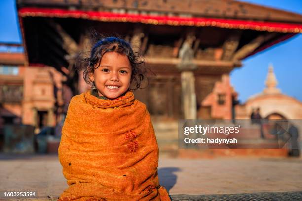 portrait of nepali little girl on durbar square in bhaktapur, nepal - nepal children stock pictures, royalty-free photos & images