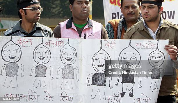 Youths shout slogans against Indian government on the one month of death of Delhi gang rape victim at Jantar Mantar on January 29, 2013 in New Delhi,...