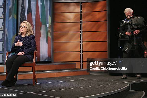 Secretary of State Hillary Clinton answers questions from students from around the world during a "Global Townterview" at the Newseum January 29,...