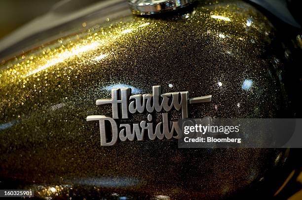 The Harley-Davidson Inc. Logo is displayed on the gas tank of a motorcycle on the showroom floor at the Dudley Perkins Co. Dealership in South San...