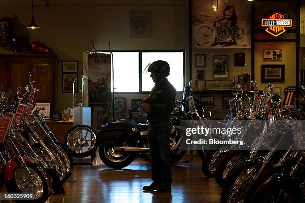Customer looks at Harley-Davidson Inc. Motorcycles on the showroom floor at the Dudley Perkins Co. Dealership in South San Francisco, California,...