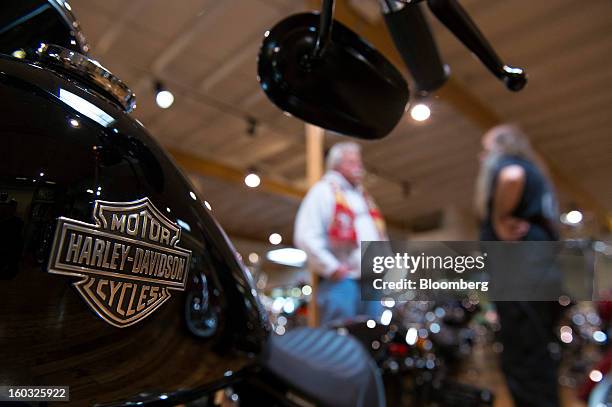 The Harley-Davidson Inc. Logo is displayed on the gas tank of a motorcycle on the showroom floor at the Dudley Perkins Co. Dealership in South San...