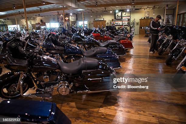 Customer looks at a Harley-Davidson Inc. Motorcycle on the showroom floor at the Dudley Perkins Co. Dealership in South San Francisco, California,...