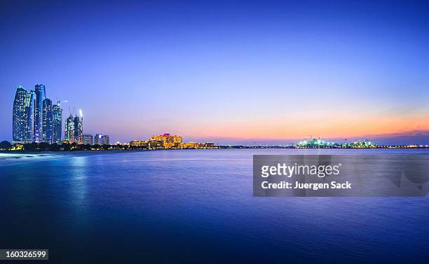 beautiful view of a city and water in abu dhabi - abu dhabi stock pictures, royalty-free photos & images