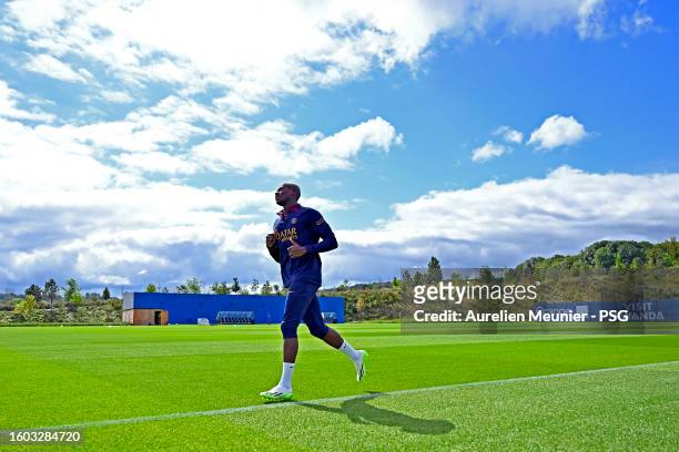 Nuno Mendes warms up during the Paris Saint-Germain training session at Campus PSG on August 09, 2023 in Paris, France.