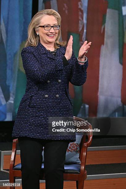 Secretary of State Hillary Clinton applauds for her audience after a "Global Townterview" at the Newseum January 29, 2013 in Washington, DC. Clinton...